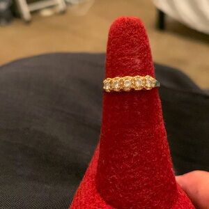 14K Gold with CZ stones.  Inside inscription reads 14k DQCZ